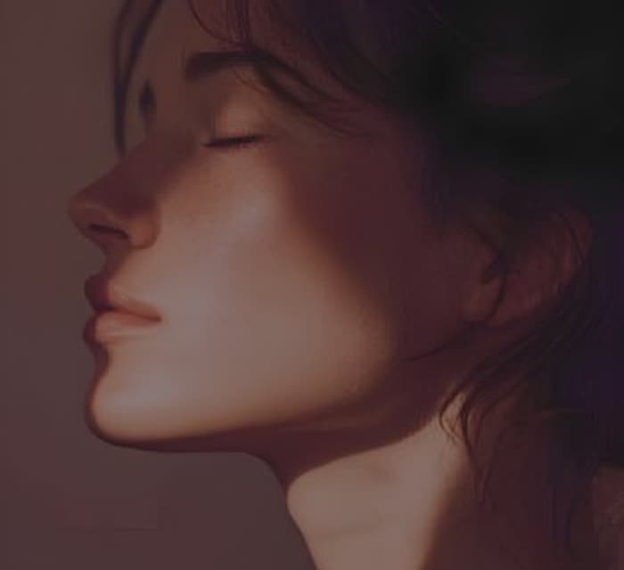 A woman in profile, eyes closed, lit by dusk light.
